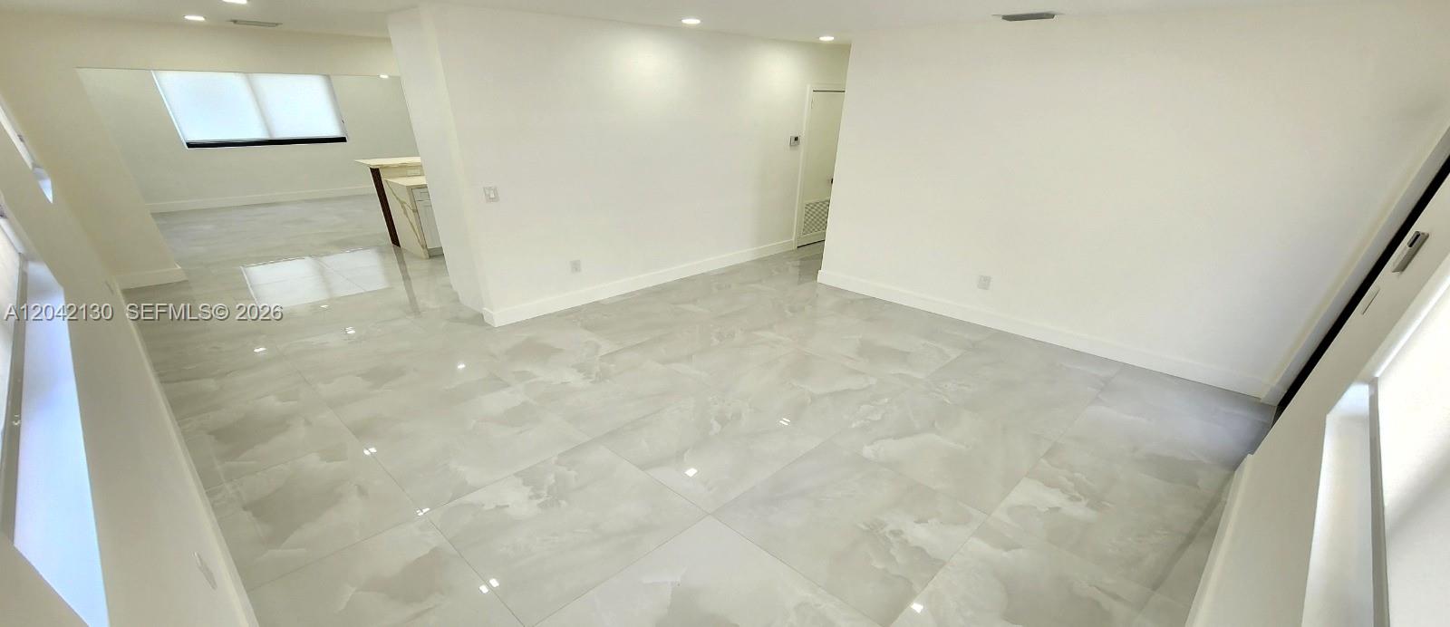 An interior view shows a room with white walls, recessed lighting, and large gray tiles — 19721 SW 114th Pl, Miami FL 33157, MIAMI, FL