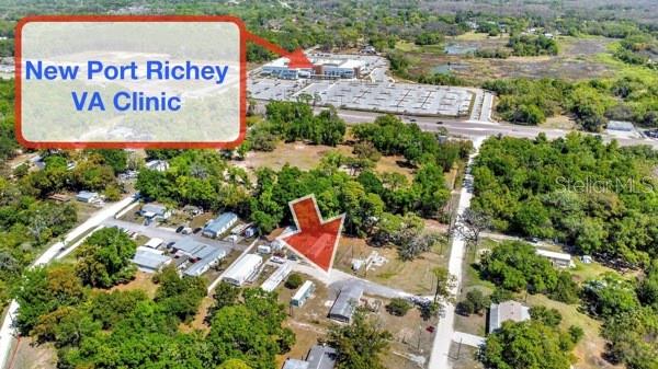 This aerial map shows a residential area near the New Port Richey VA Clinic — 8325 EMMONS AVENUE, NEW PORT RICHEY, FL