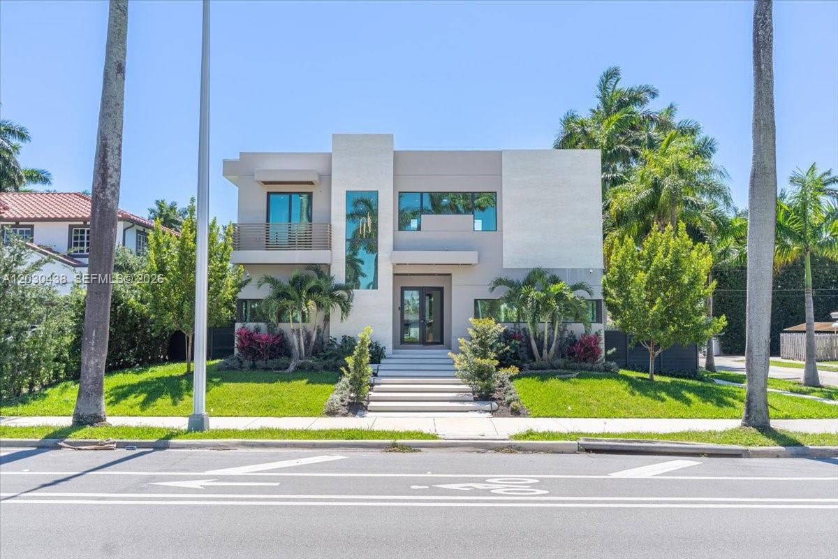 A modern two-story house with a flat roof, light-colored facade, and a front lawn — 1380 Hollywood Blvd, Hollywood FL 33019, HOLLYWOOD, FL