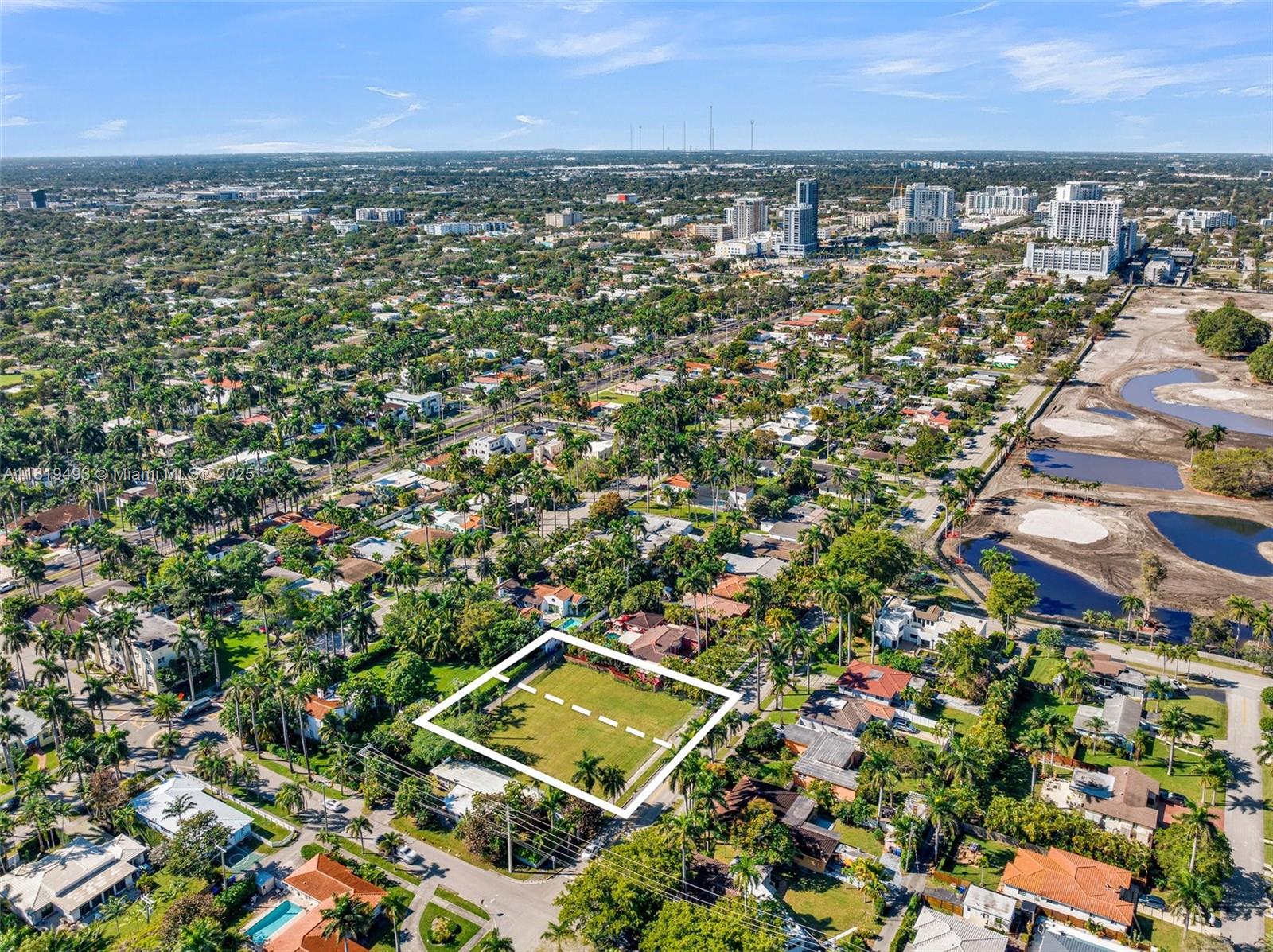 An aerial view shows a vacant rectangular lot outlined in white within a residential neighborhood — 1310 Polk St, Hollywood FL 33019, HOLLYWOOD, FL