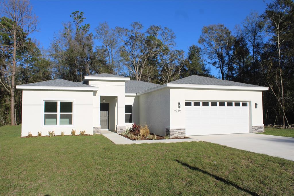 This is a 3D floor plan rendering of a single-story house with a two-car garage — 9719 N SANDREE DRIVE, CITRUS SPRINGS, FL