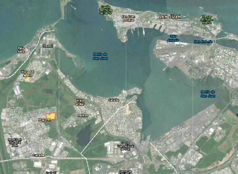 This is an aerial map showing the San Juan Bay area with a highlighted property — PR-8869 AT KILOMETER 0.7, PALMAS WARD, CAT, CATANO, PR