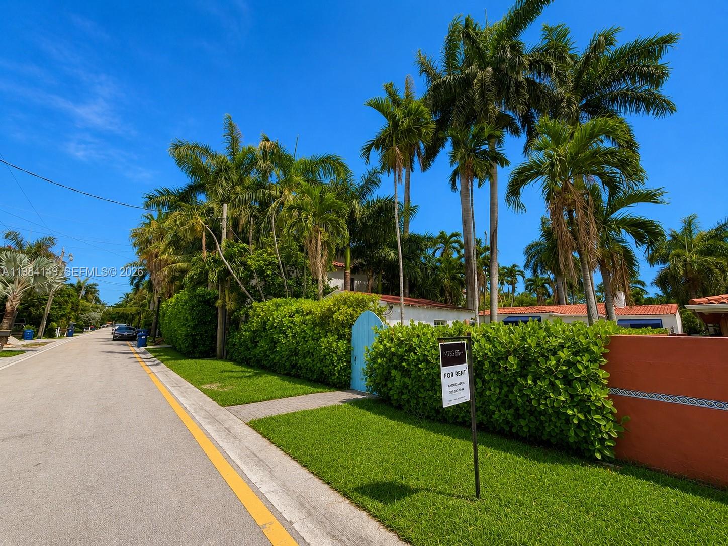 A street view shows a house behind a tall hedge with a for rent sign — 265-B Palm Ave, Miami Beach FL 33139, MIAMI BEACH, FL