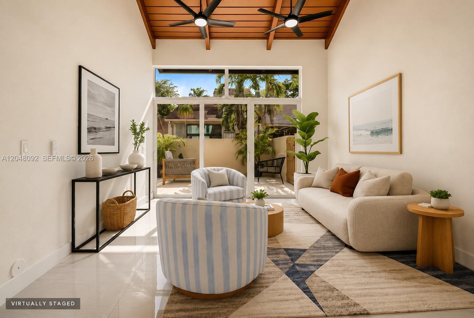 This virtually staged living room features a vaulted wood ceiling, tile floors, and glass doors — 11621 SW 90th St, Miami FL 33176, MIAMI, FL