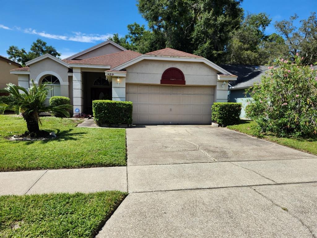 1409 WOODFIELD OAKS DRIVE