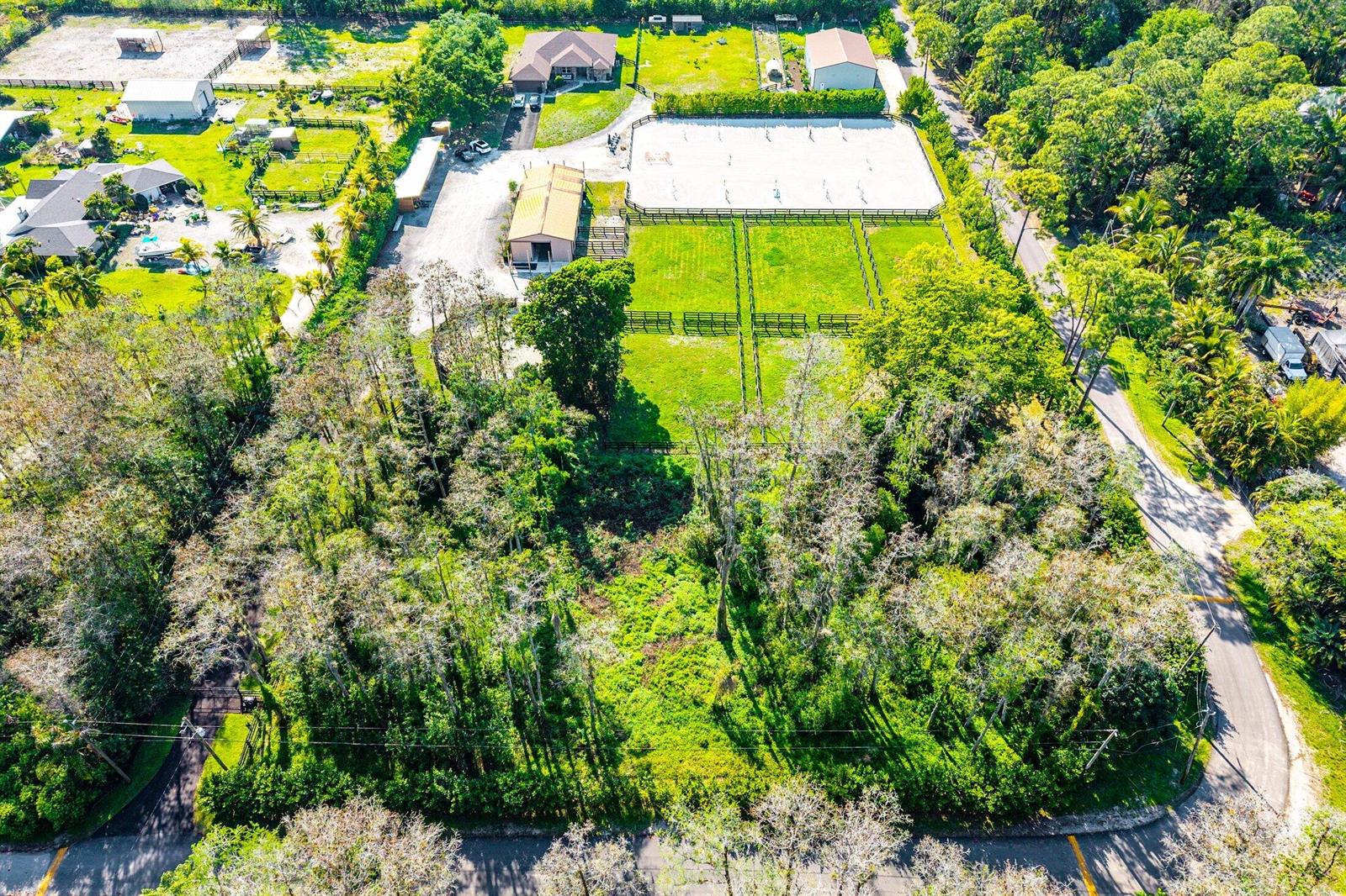 An aerial view shows a rural property with a house, barn, riding arena, and pastures — 6149 Park Lane E, Lake Worth FL 33449, LAKE WORTH, FL