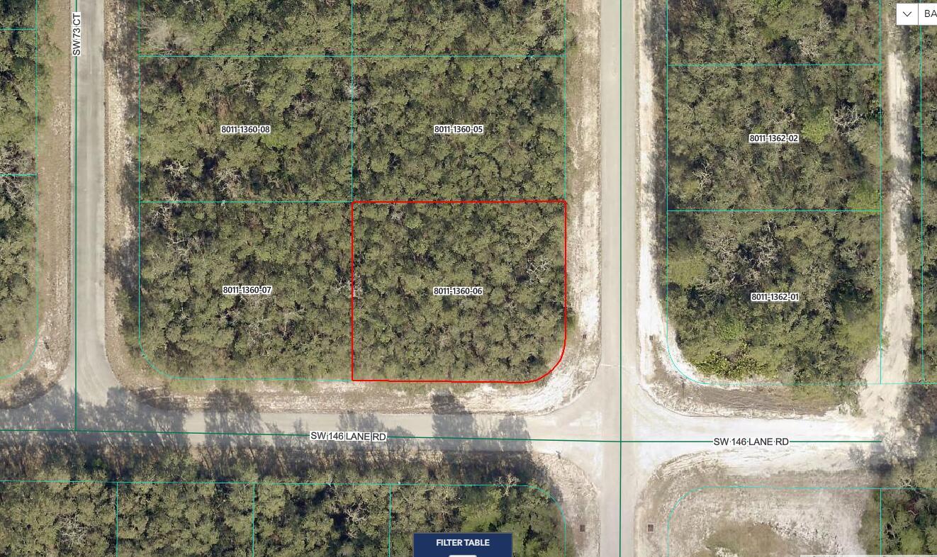 This is a map showing a wooded, rectangular land parcel highlighted in red at an intersection — Tbd SW 146th Ln Road, Ocala FL 34473, OCALA, FL