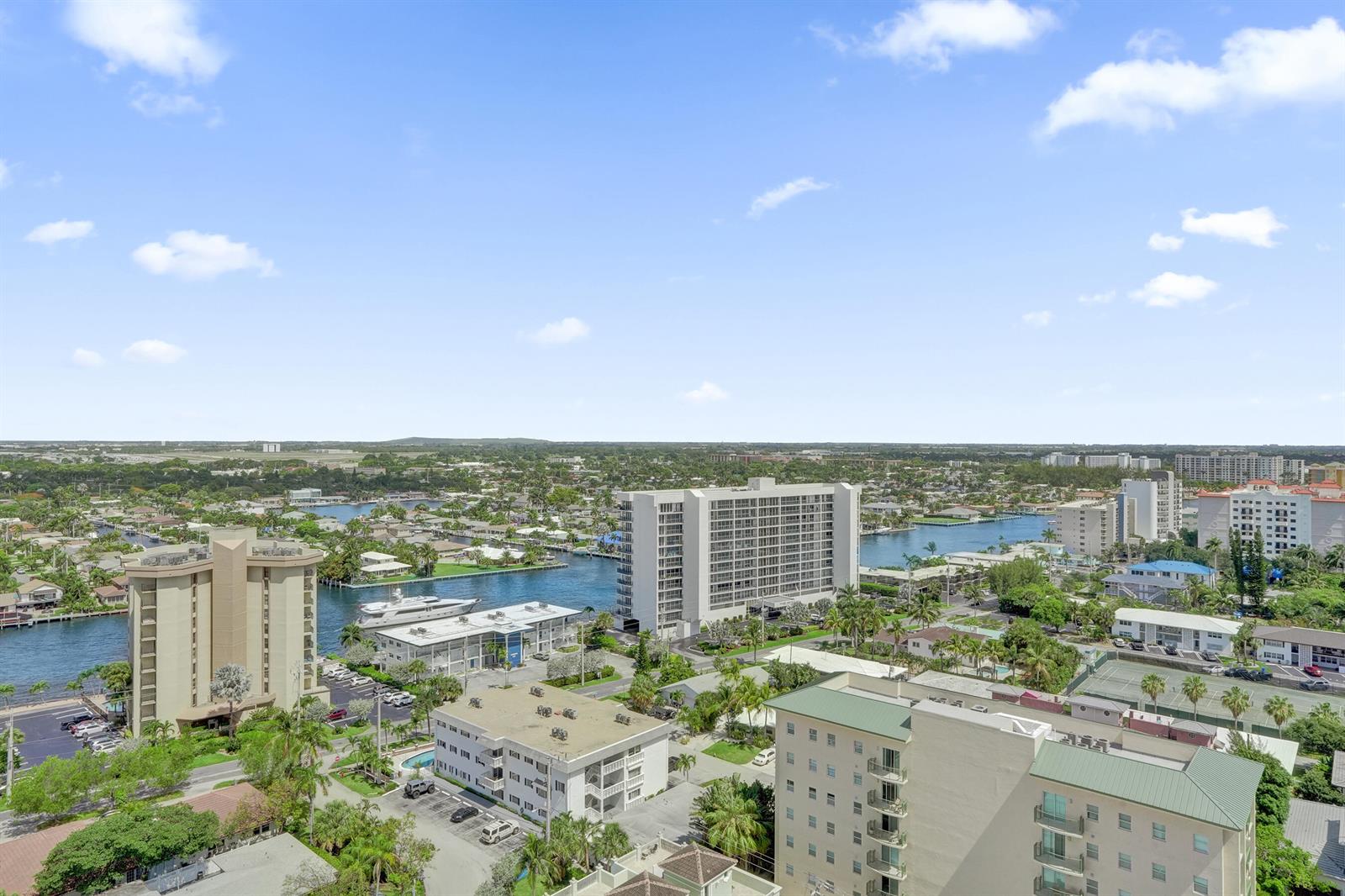 An aerial view shows multiple apartment buildings, a canal with boats, and surrounding residential areas — 405 N Ocean Boulevard # 1929, Pompano Beach FL 33062, POMPANO BEACH, FL
