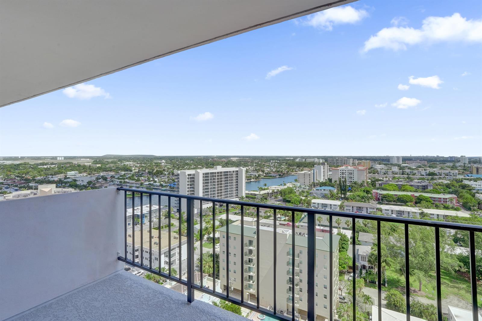A high-angle view from a balcony overlooking a city, waterways, and residential buildings — 405 N Ocean Boulevard # 1929, Pompano Beach FL 33062, POMPANO BEACH, FL