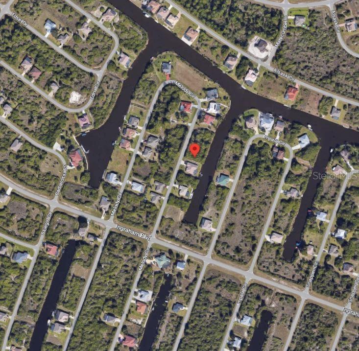 This is an aerial map view of a residential neighborhood with houses and canals — 9270 MELODY CIRCLE, PORT CHARLOTTE, FL