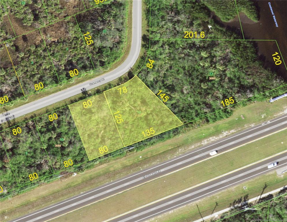 This is an aerial map showing a highlighted vacant lot bordered by roads and vegetation — 2286 GRAMERCY STREET, PORT CHARLOTTE, FL