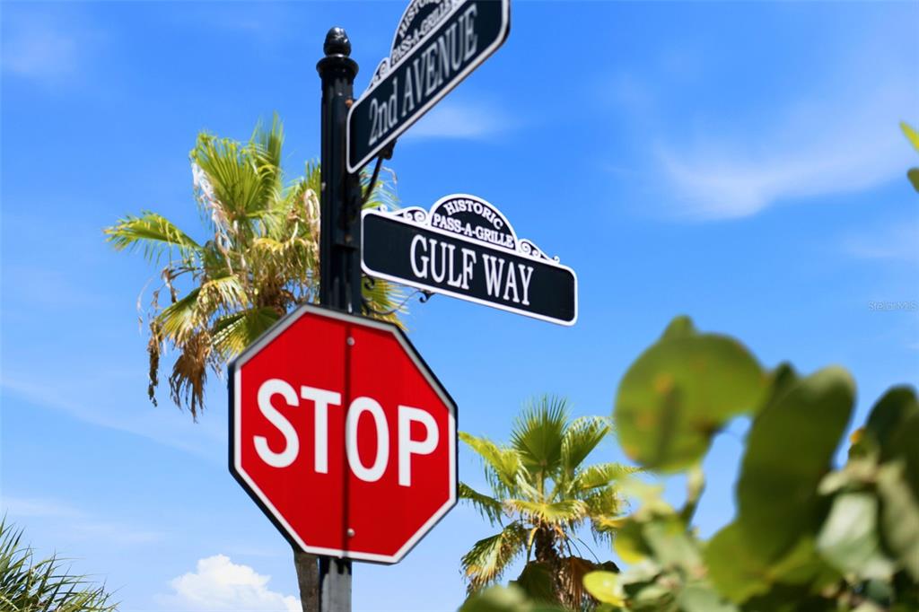 A stop sign stands below street signs for 2nd Avenue and Gulf Way in Pass-a-Grille — 106 2ND AVENUE, ST PETE BEACH, FL