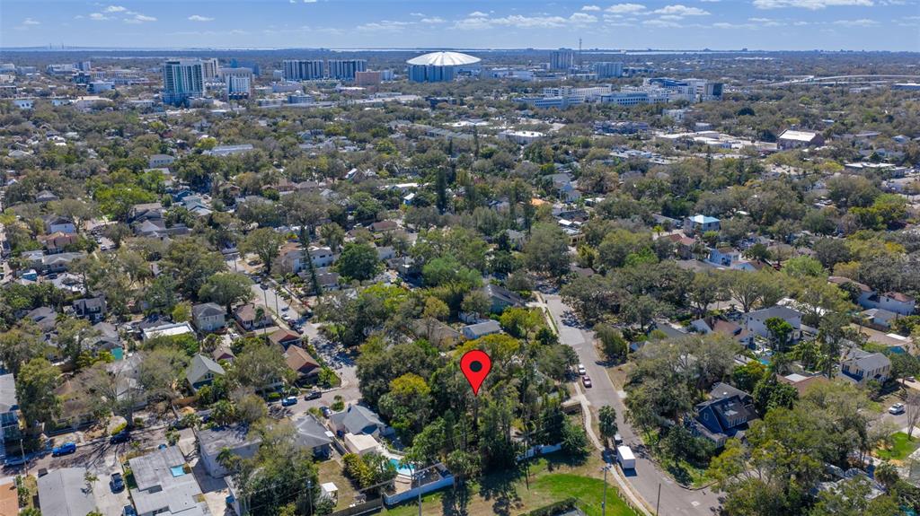 An aerial view shows a residential neighborhood with a red location pin over a property — 711 12TH AVENUE N, ST PETERSBURG, FL