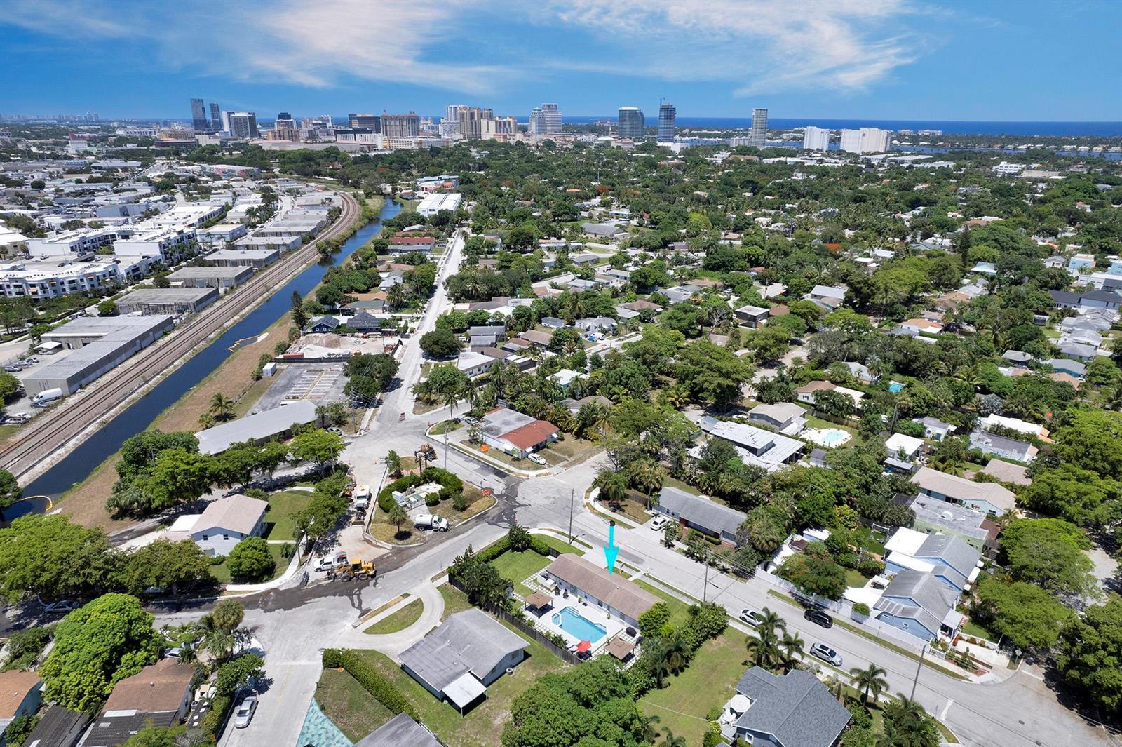 An aerial view shows a residential neighborhood with a house featuring a backyard swimming pool — 2301 Ridgeway Avenue, West Palm Beach FL 33401, WEST PALM BEACH, FL
