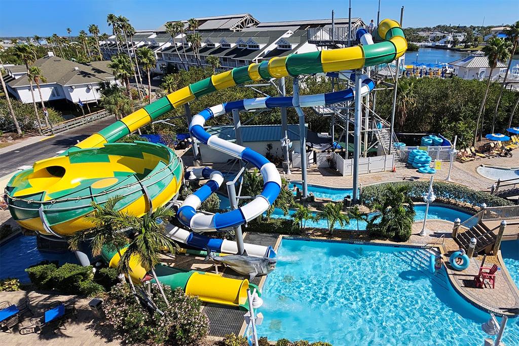 An aerial view of a colorful water slide and swimming pool at a resort — 399 2ND STREET UNIT 416, INDIAN ROCKS BEACH, FL