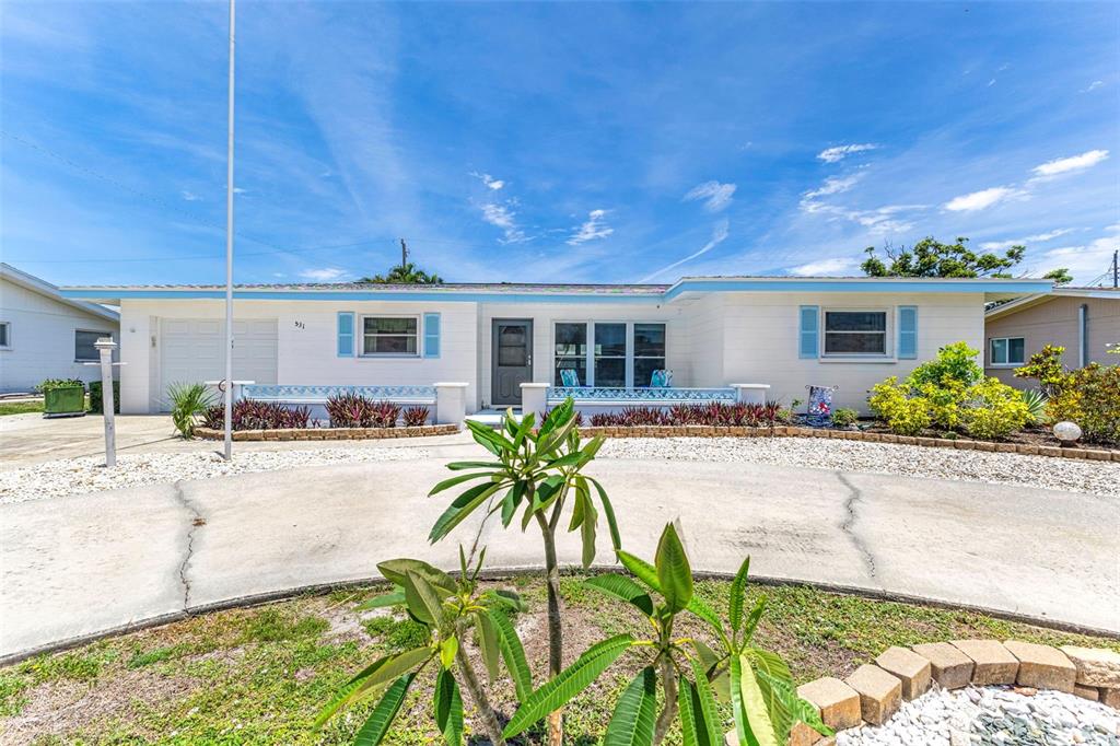 An aerial view of a single-story house with a white exterior, garage, and circular driveway — 531 SHERIDAN DRIVE, VENICE, FL