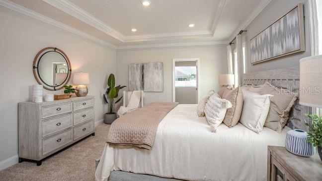 A bedroom features a king-sized bed, a wooden dresser, a round mirror, and neutral decor — TBD SW 31ST TERRACE ROAD, OCALA, FL
