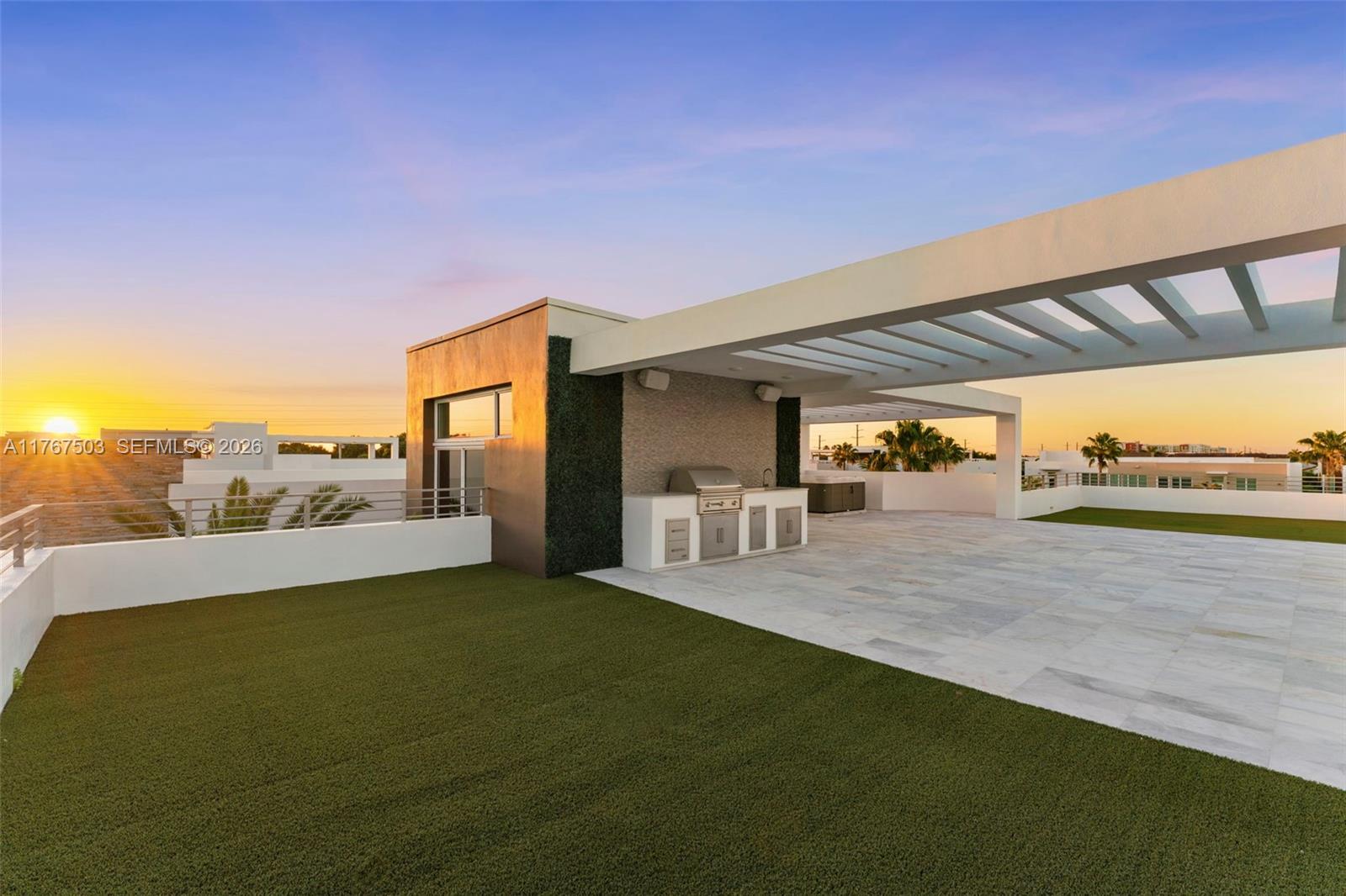 A rooftop terrace features a built-in outdoor kitchen, a pergola, and artificial turf flooring — 10561 NW 67th Ter # 10561, Doral FL 33178, DORAL, FL