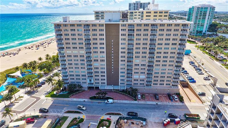 An aerial view shows the Ocean Monarch residential building situated next to a sandy beach — 133 N Pompano Beach Blvd Boulevard # 7, Pompano Beach FL 33062, POMPANO BEACH, FL