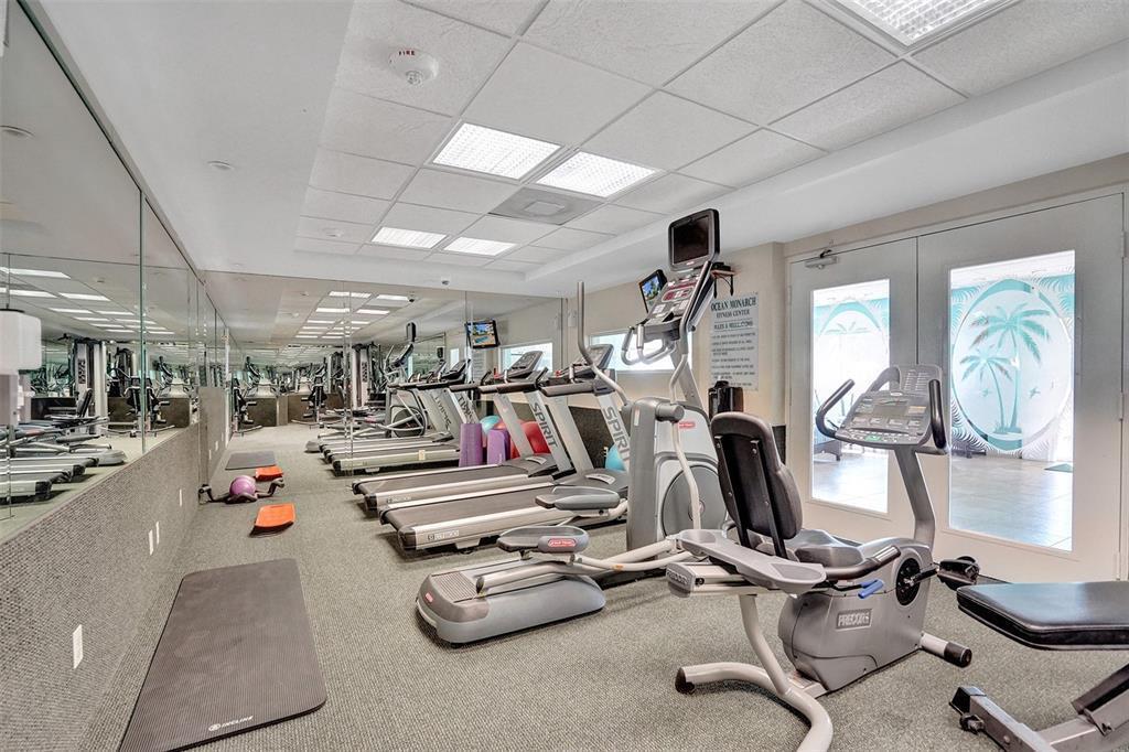 A fitness center features treadmills, an elliptical, a stationary bike, and a mirrored wall — 133 N Pompano Beach Blvd Boulevard # 7, Pompano Beach FL 33062, POMPANO BEACH, FL