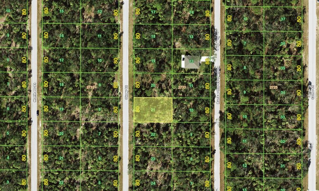 This is a satellite map view showing a highlighted vacant residential lot among wooded properties — 3112 OLNEY STREET, PORT CHARLOTTE, FL