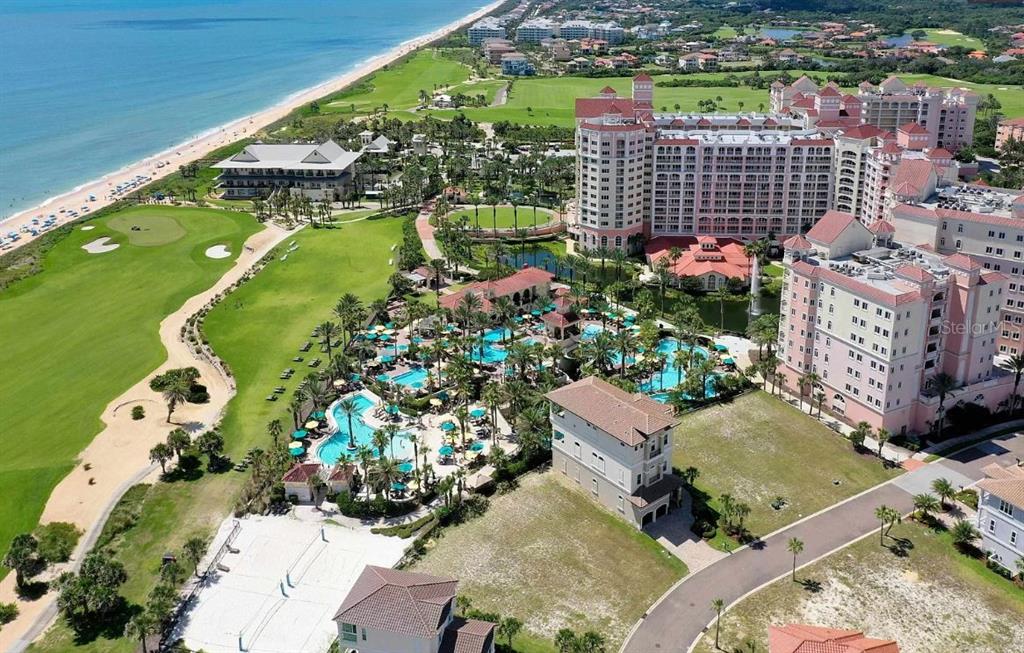 An aerial view of a large coastal resort with swimming pools, golf courses, and buildings — 200 OCEAN CREST DRIVE UNIT 325, PALM COAST, FL