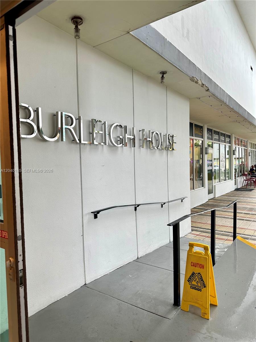 The exterior of the Burleigh House building features a white wall with metal lettering — 7135 Collins Ave # 1523, Miami Beach FL 33141, MIAMI BEACH, FL