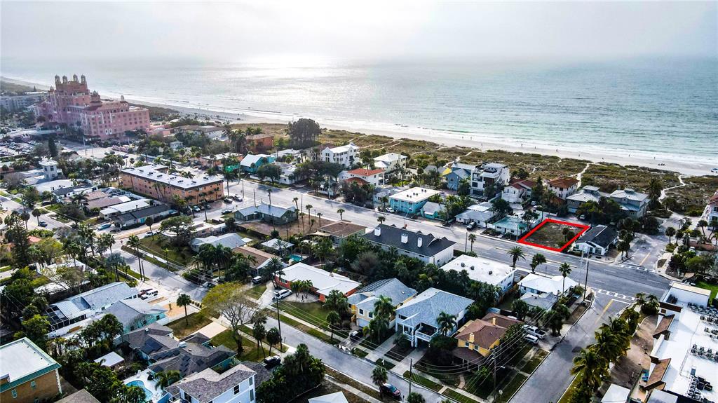 An aerial view shows the pink Don CeSar hotel situated on a sandy beach — 3614 GULF BOULEVARD, ST PETE BEACH, FL