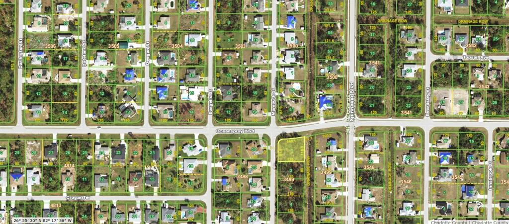 This is a satellite map view of a residential neighborhood with houses and vacant lots — 7274 MAMOUTH STREET, ENGLEWOOD, FL