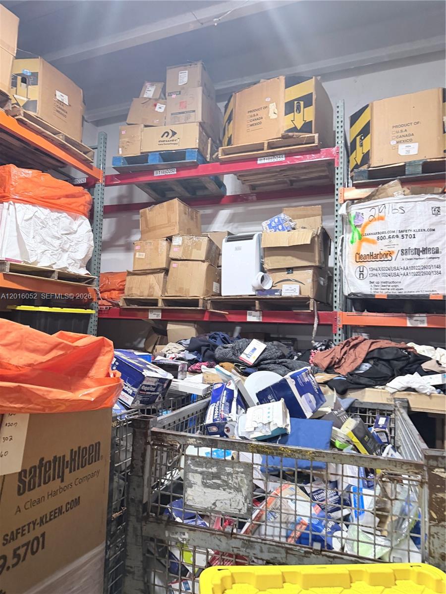 A storage room features metal shelving units filled with cardboard boxes and miscellaneous items — 188, Cutler Bay FL 33157, CUTLER BAY, FL