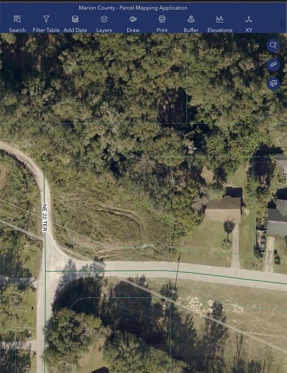 This is a parcel map showing a wooded lot with a house and a road — 0000 NE 55TH STREET, OCALA, FL