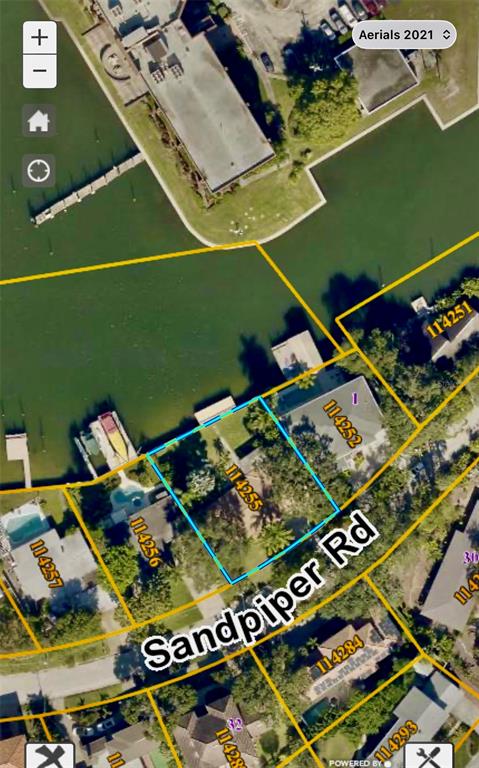 This is an aerial map showing a residential property lot outlined in blue — 52 SANDPIPER ROAD, TAMPA, FL