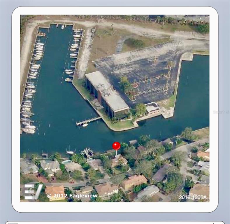 An aerial view shows a house marked with a pin near a marina and waterway — 52 SANDPIPER ROAD, TAMPA, FL