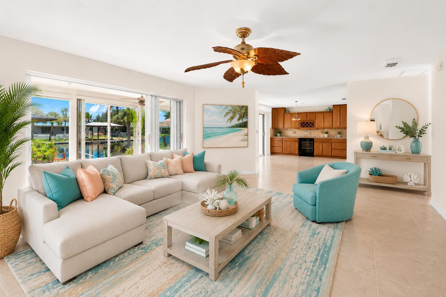A living room features a sectional sofa, teal armchair, coffee table, and an open kitchen — COCOA BEACH, FL