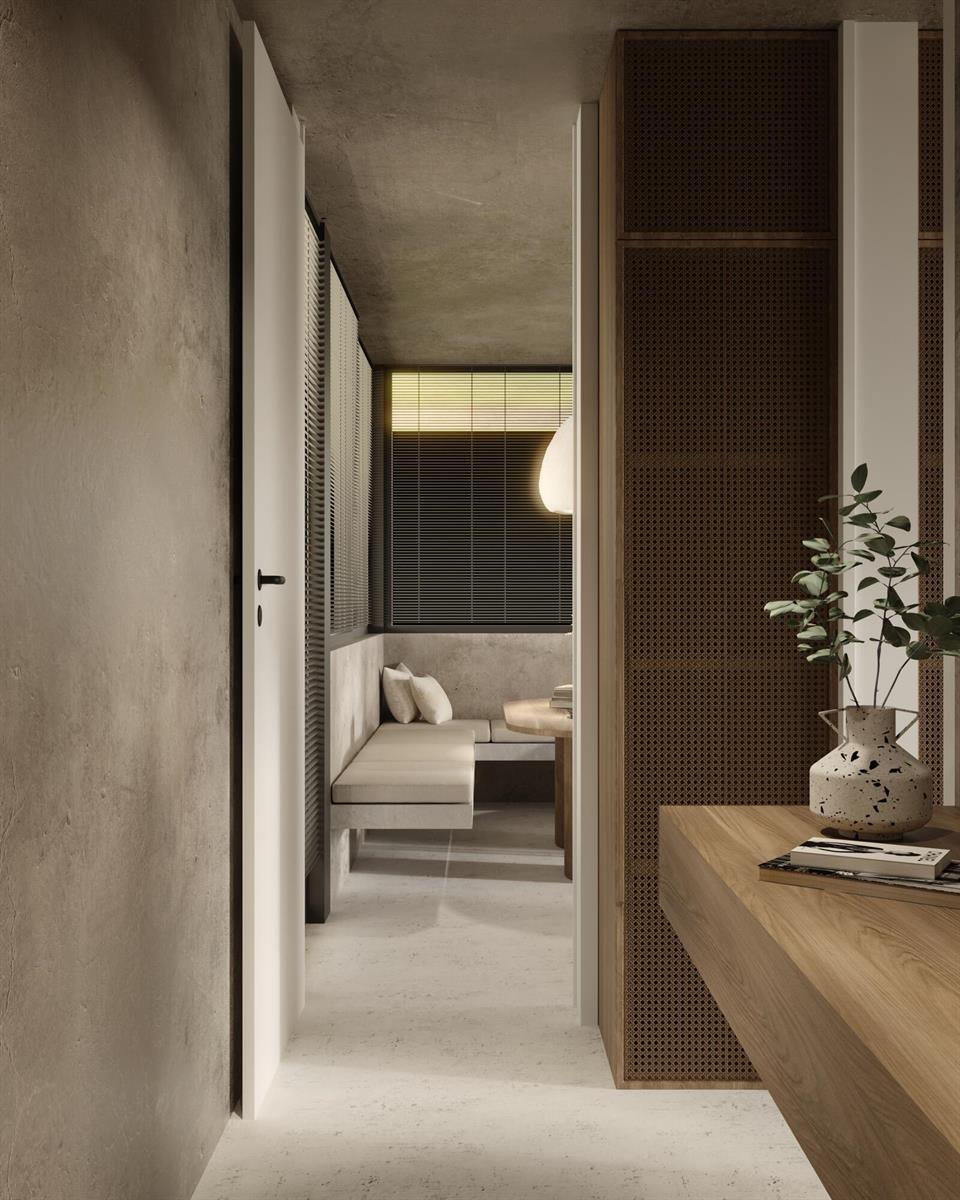 A rendering of a minimalist interior showing a hallway leading to a small seating area — 250 Bluff Bch Rd, Bocas Del Toro,, FL