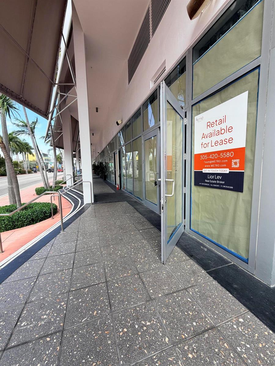 A commercial storefront with glass doors and windows under a covered walkway along a street — 6801 Collins Avenue # 1215, Miami Beach FL 33141, MIAMI BEACH, FL