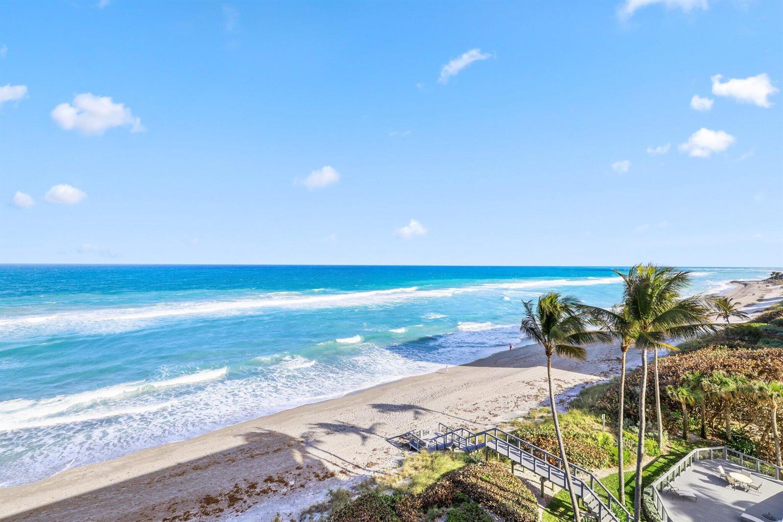 A spacious balcony features tile flooring, a black metal railing, and ocean views — 19750 S Beach Road # 7050, Jupiter FL 33469, JUPITER, FL