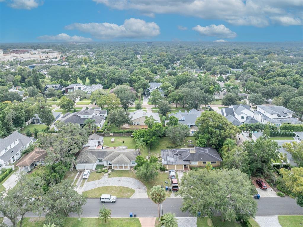 An aerial view shows two single-story houses with driveways and trees in a suburban neighborhood — 1780 BRYAN AVENUE, WINTER PARK, FL