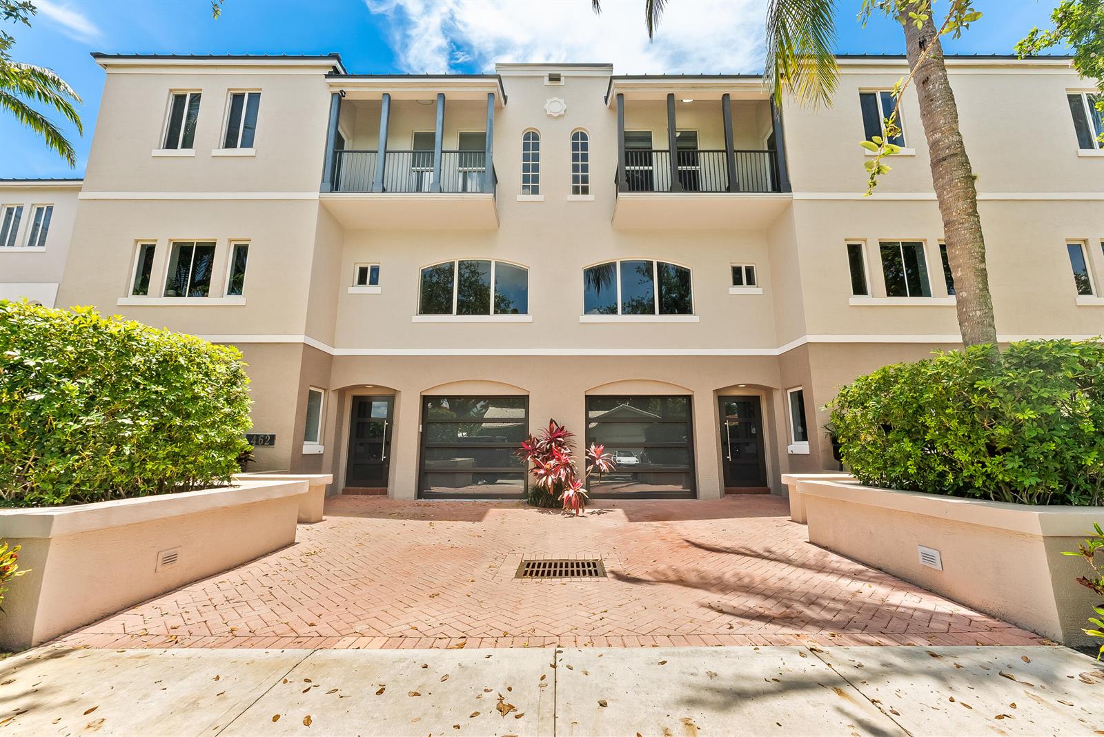 A three-story building exterior features two garages, balconies, and a brick-paved driveway — 456 E Boca Raton Road, Boca Raton FL 33432, BOCA RATON, FL