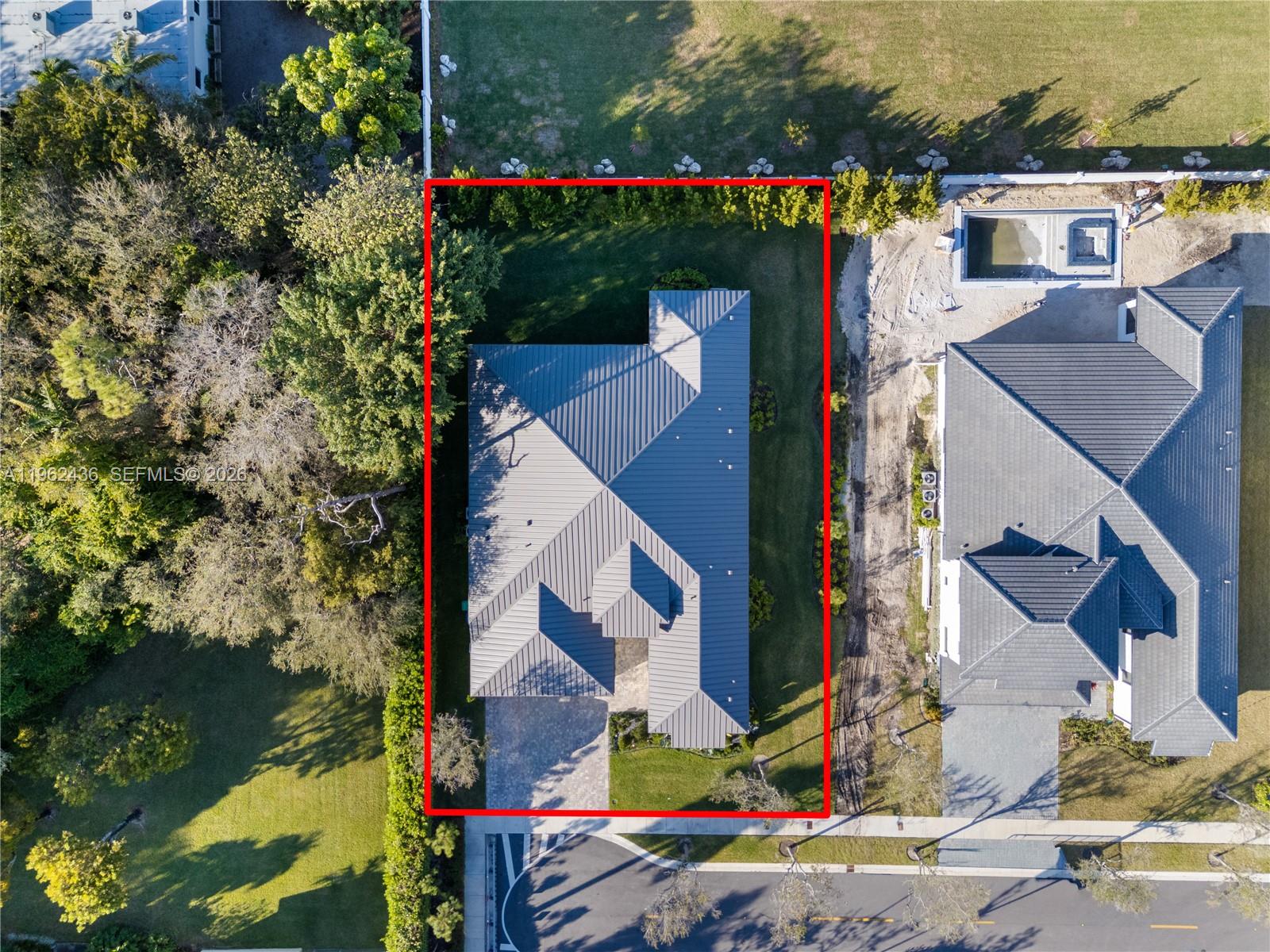 An aerial view shows a house with a metal roof on a rectangular lot — 7387 SW 74th Ln, Miami FL 33143, MIAMI, FL
