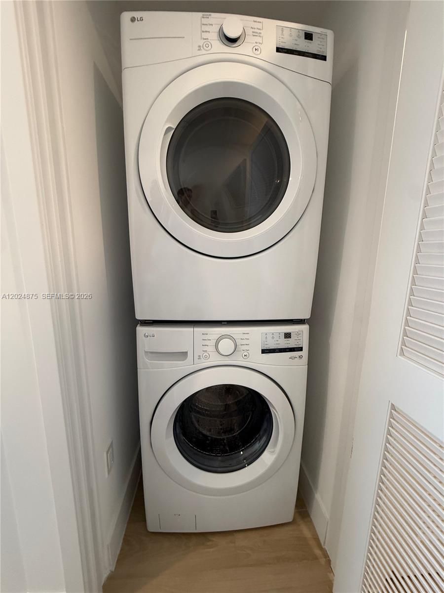 A stacked LG washer and dryer unit is installed in a small laundry closet — 90 NE 32 # 1016, Miami FL 33137, MIAMI, FL