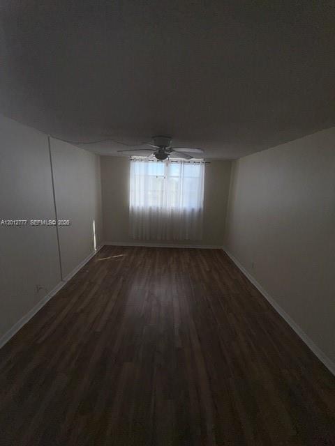 An empty room features wood-look flooring, white walls, and a ceiling fan — 406 NW 68th Ave # 411, Plantation FL 33317, PLANTATION, FL