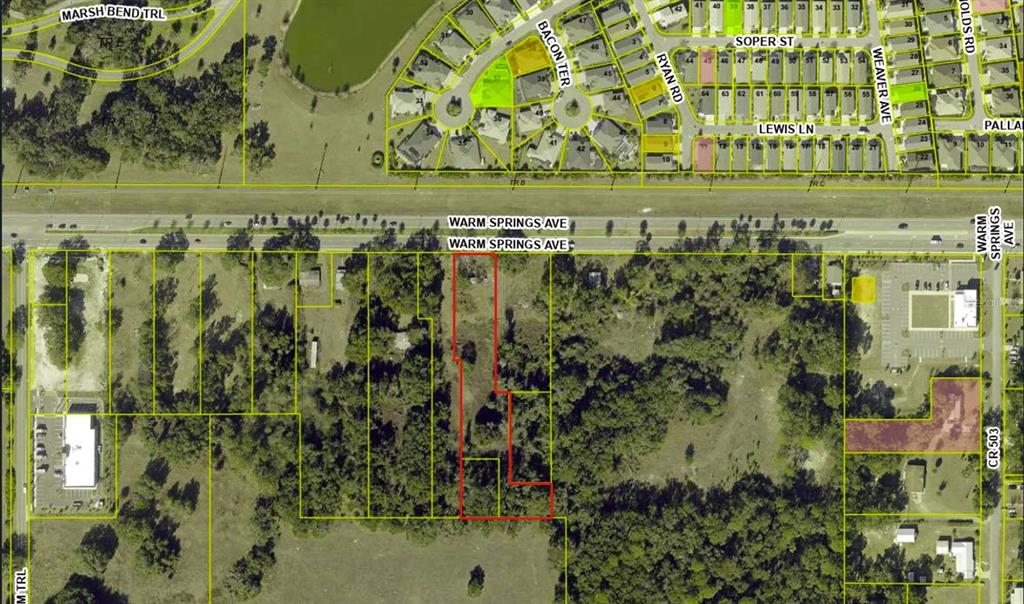 This is an aerial map showing a highlighted property parcel along a road — 5211 WARM SPRINGS AVENUE, WILDWOOD, FL
