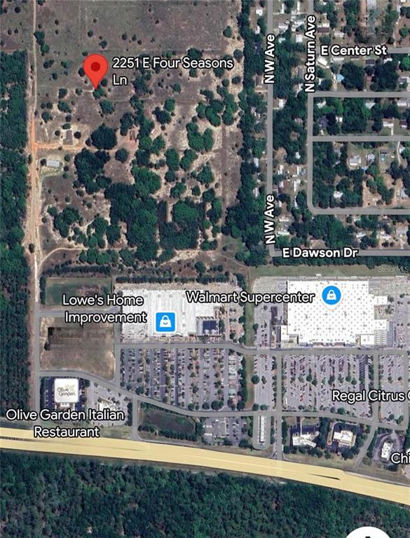 This is an aerial map showing a residential property location near commercial retail stores — 2251 E FOUR SEASONS LANE, INVERNESS, FL