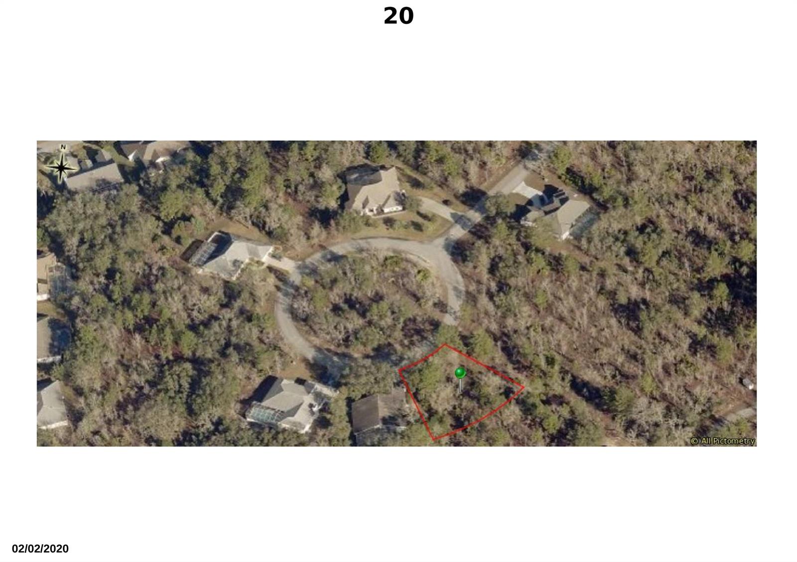 This aerial map shows a vacant, wooded residential lot outlined in red within a cul-de-sac — 20 Dahlia Court S, FL 34446, FL