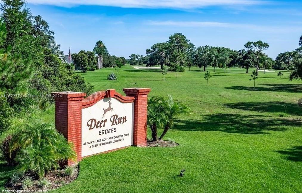 A brick sign for Deer Run Estates stands in a grassy field with trees — 8525 BALADA DR, Sebring FL 33872, SEBRING, FL
