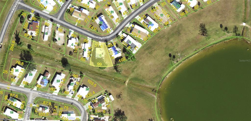 This is an aerial map showing residential lots, streets, and a pond — 7368 VARLEY CIRCLE, PORT CHARLOTTE, FL