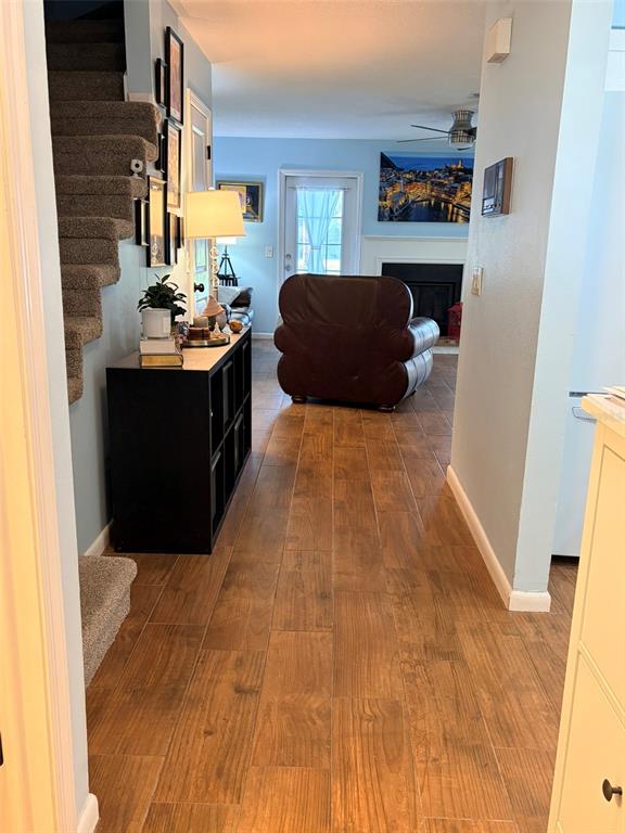 A kitchen with white cabinets, stainless steel appliances, and light blue walls — 16302 RAMBLING VINE DRIVE W, TAMPA, FL