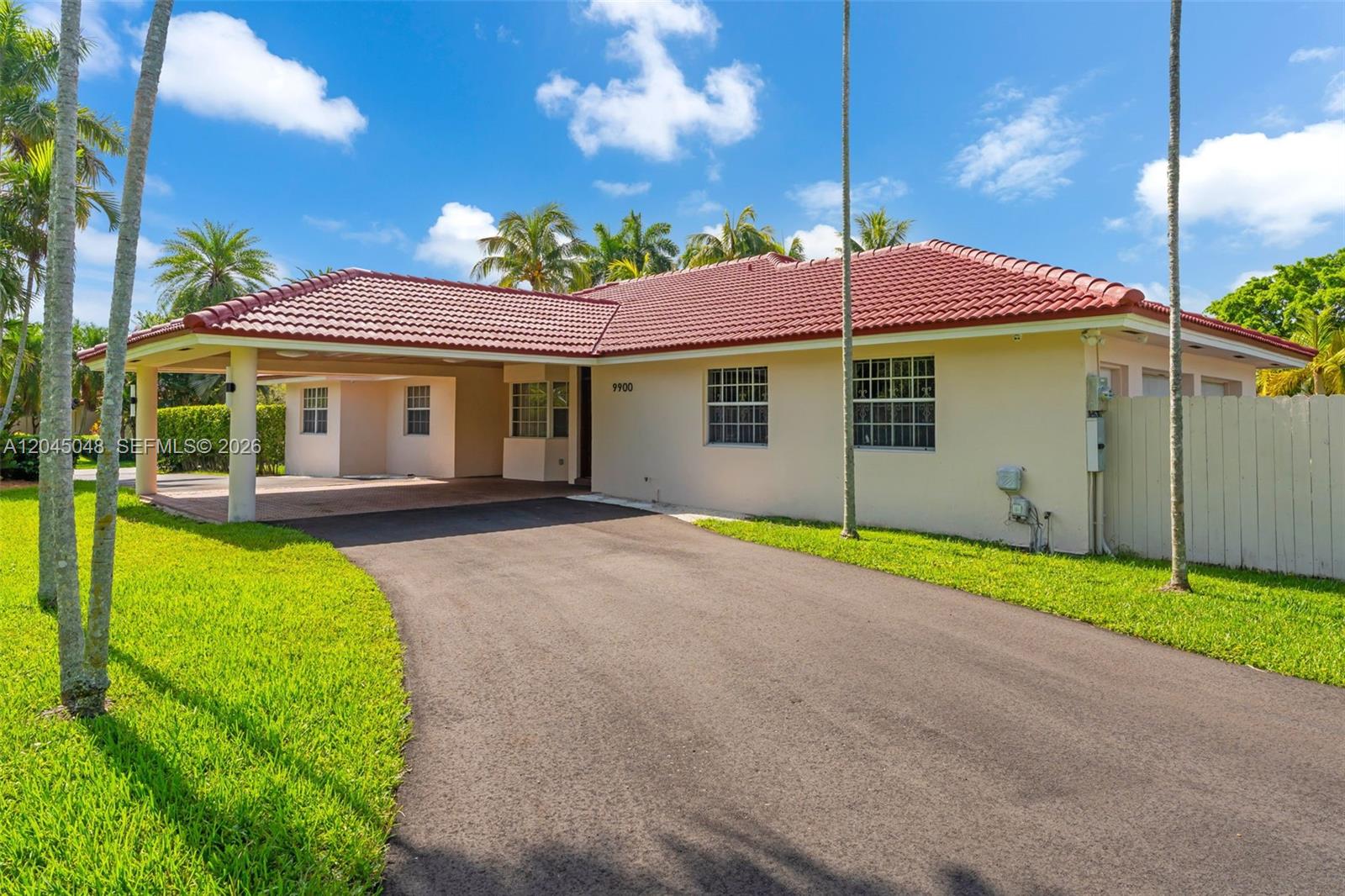 A single-story house with a metal roof, covered patio, and swimming pool in the backyard — 9900 SW 62nd St, Miami FL 33173, MIAMI, FL