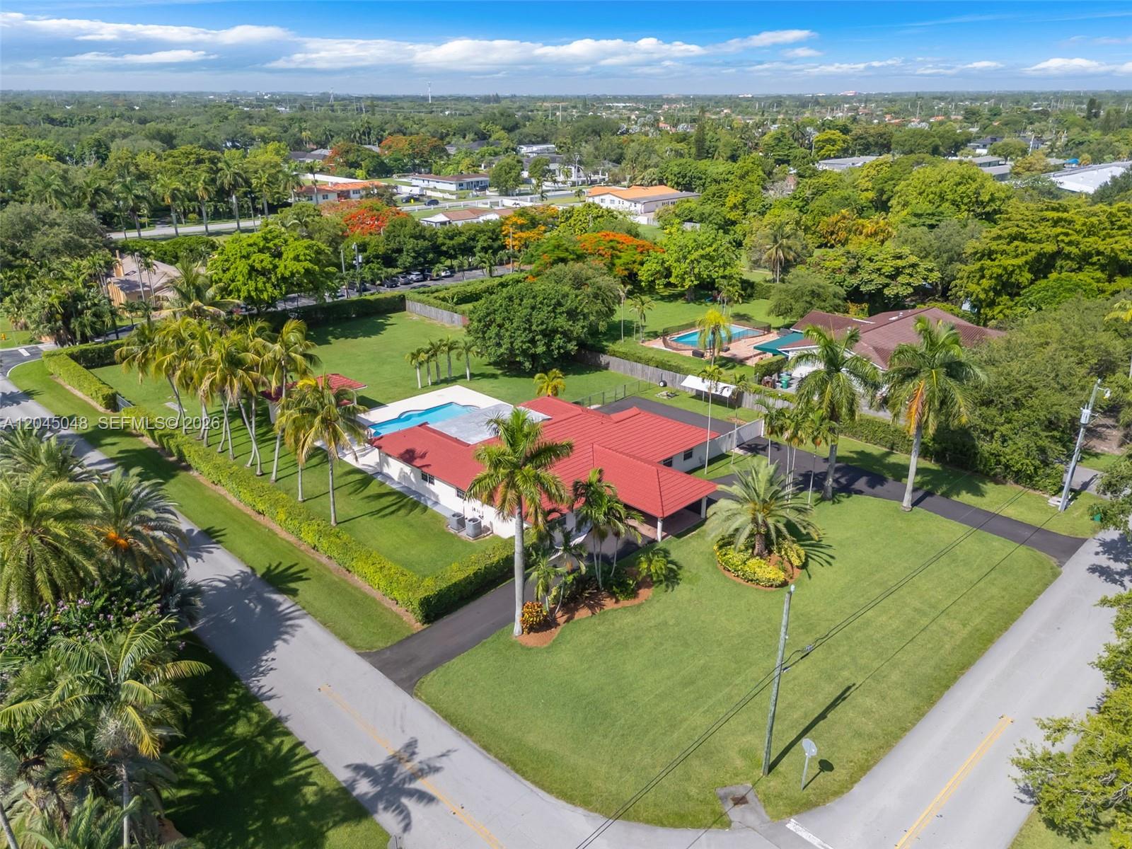 A single-story house with a red tile roof, a carport, and a paved driveway — 9900 SW 62nd St, Miami FL 33173, MIAMI, FL